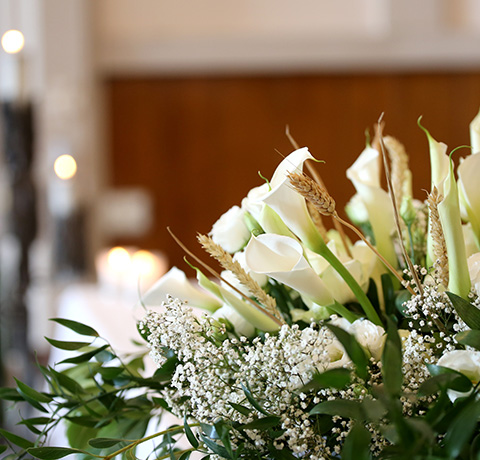 a closeup of flowers at a funeral